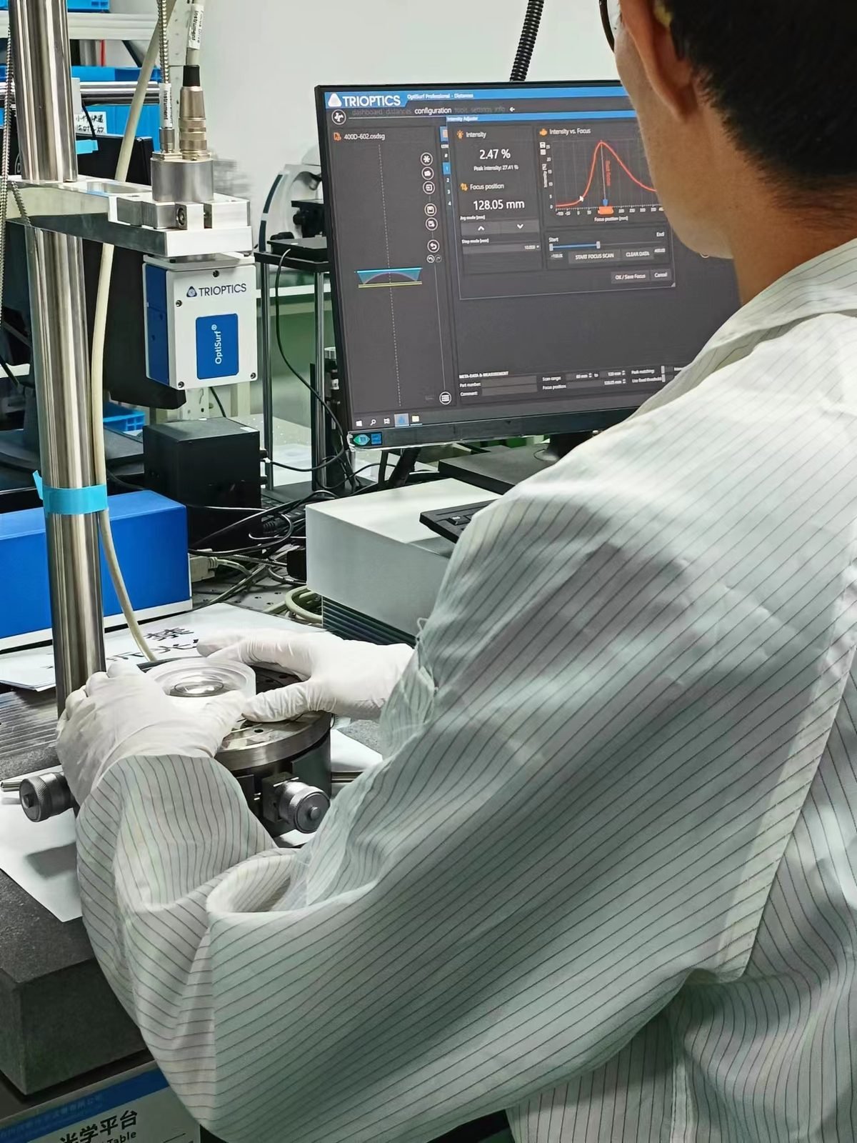 Lensmind engineer measuring an optic on a Trioptics OptiSurf station