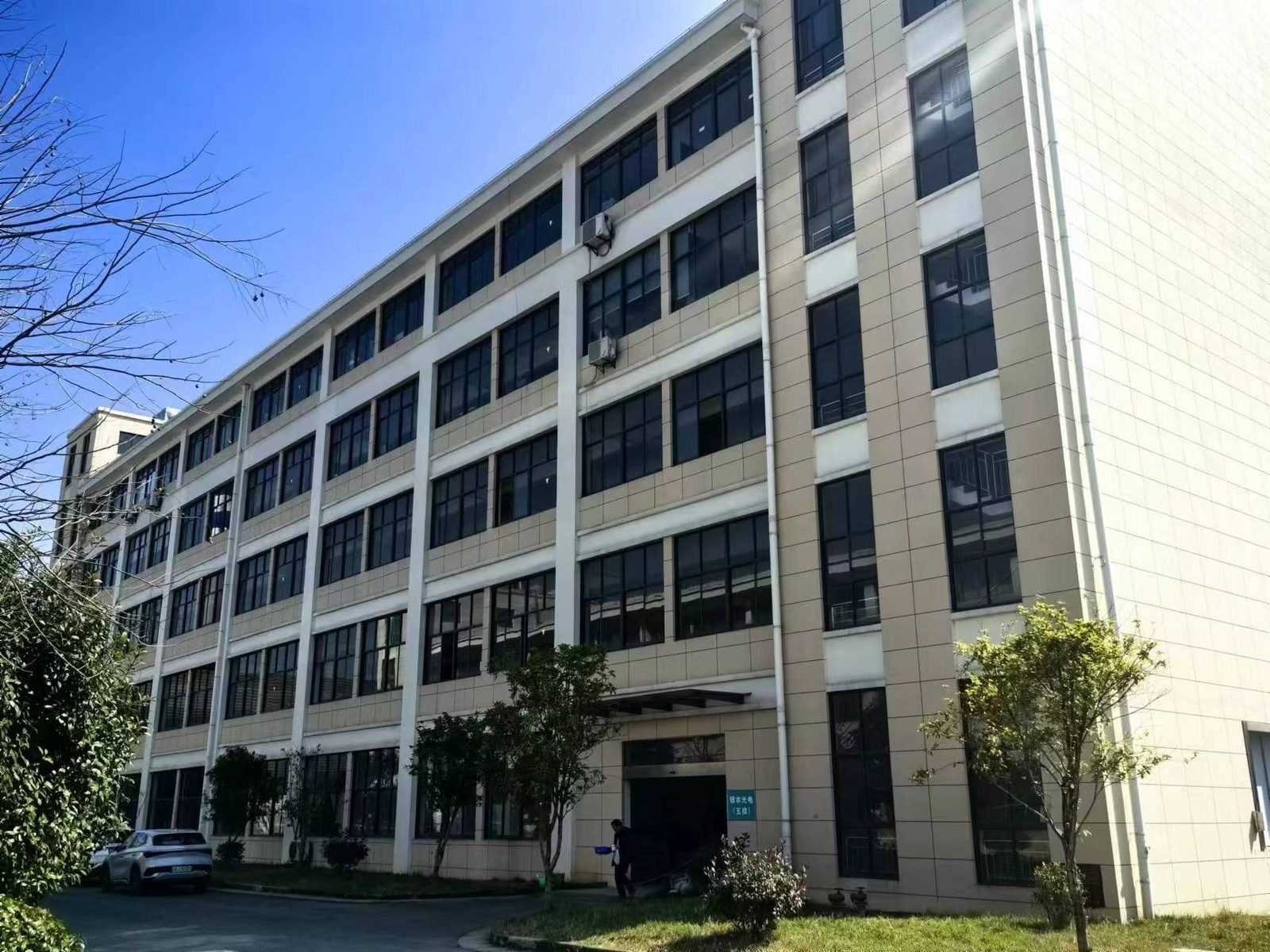 Zone B — precision lens manufacturing line at Lensmind factory